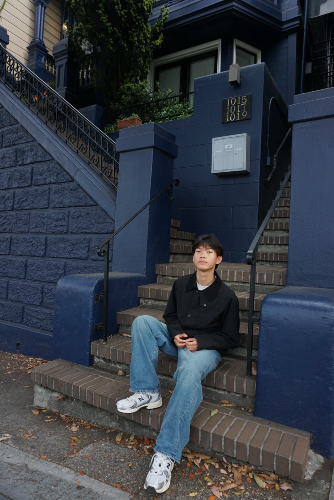 Shawn sitting on outdoor steps