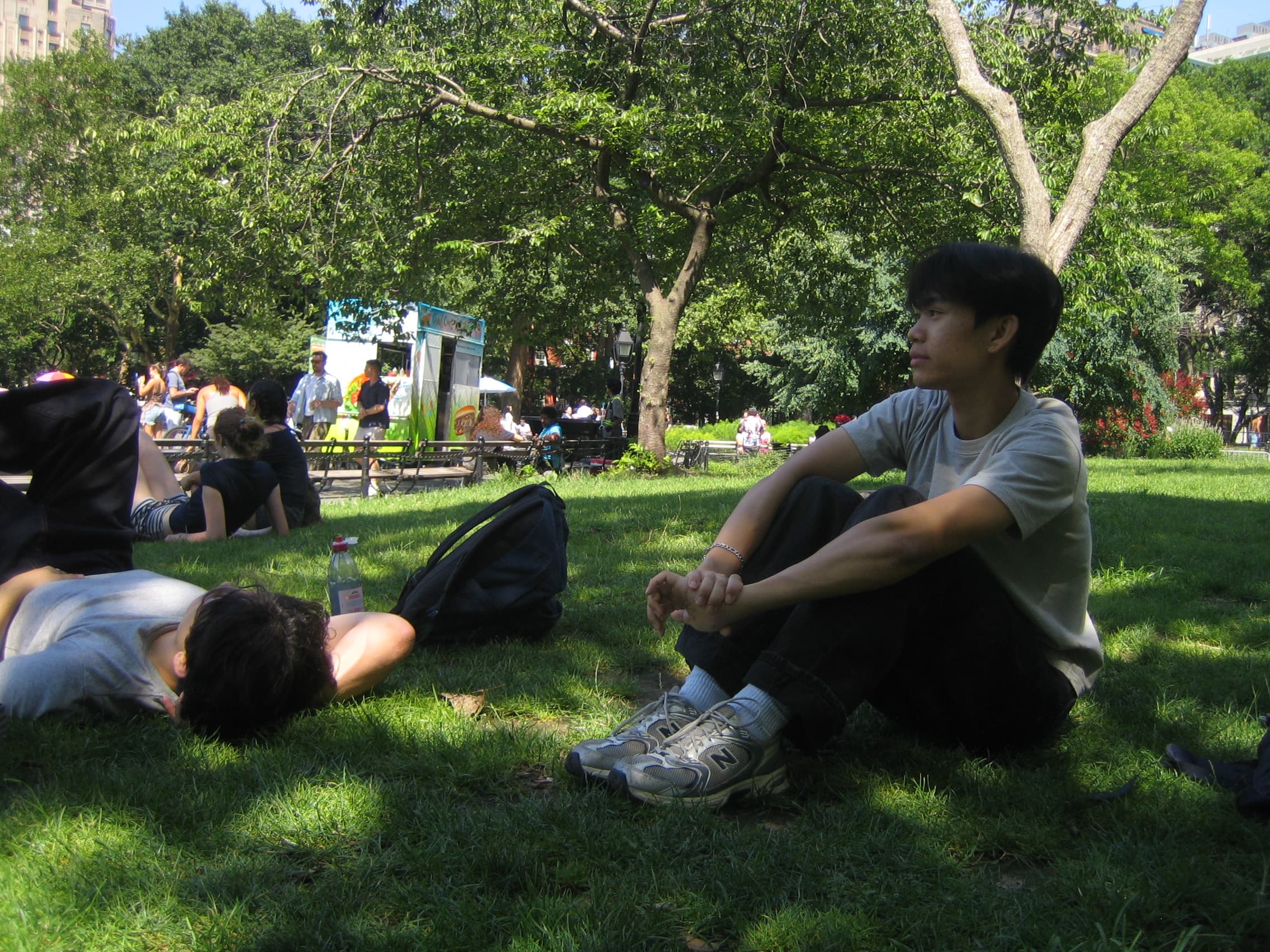 Shawn relaxing with friends in a park